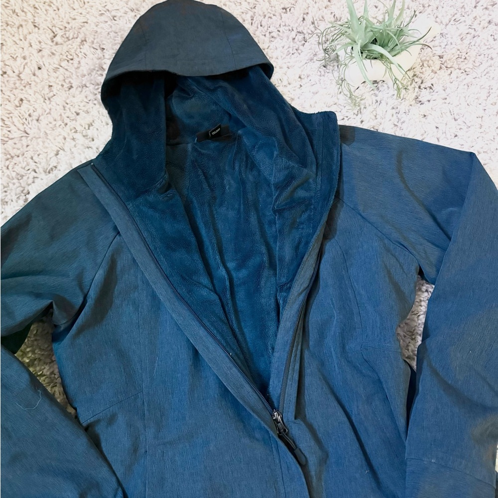 Blue women’s heavy duty athletic hiking outdoor windbreaker jacket with …
